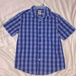 Blue stripped short sleeved shirt and sized 10-12